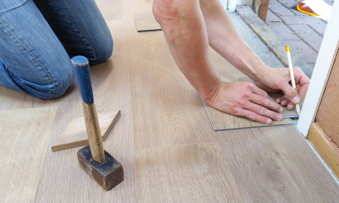 measuring out tiles for a home reno